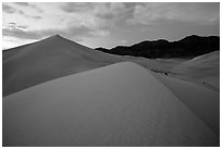 Ibex Sand Dunes and mountains at dusk. Death Valley National Park ( black and white)