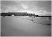 White gypsum dunes and Guadalupe range at sunset. Guadalupe Mountains National Park ( black and white)