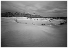 Gypsum sand dunes and last light on Guadalupe range. Guadalupe Mountains National Park ( black and white)