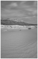 Gypsum sand dunes and Guadalupe range at sunset. Guadalupe Mountains National Park, Texas, USA. (black and white)