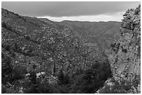 Cliffs and forested slopes, approaching storm. Guadalupe Mountains National Park ( black and white)