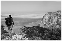 Hiker walking on Guadalupe Peak. Guadalupe Mountains National Park, Texas, USA. (black and white)