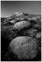 Limestone boulders and El Capitan from the South, dusk. Guadalupe Mountains National Park, Texas, USA. (black and white)