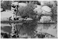 Photographer with large format camera at Barker Dam. Joshua Tree National Park ( black and white)