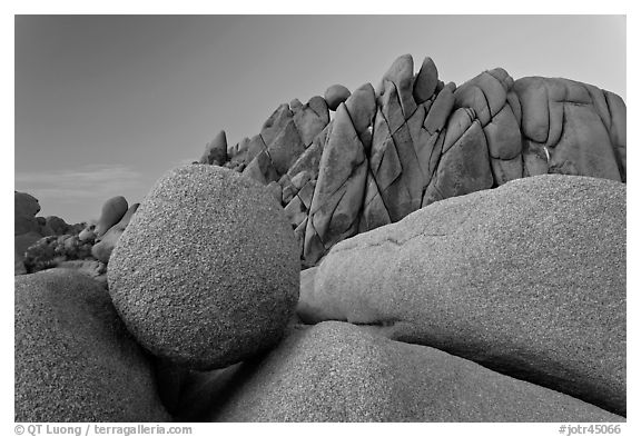 Round granite boulder and triangular rocks, dusk. Joshua Tree National Park (black and white)