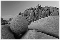 Round granite boulder and triangular rocks, dusk. Joshua Tree National Park ( black and white)