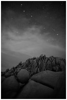 Geometrically shaped rocks and stars at night. Joshua Tree National Park ( black and white)