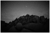 Geometrically shaped rocks and clear starry sky. Joshua Tree National Park ( black and white)