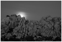 Moonset over rocks delimiting Hidden Valley. Joshua Tree National Park ( black and white)
