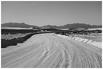 Unpaved road over sands. White Sands National Park ( black and white)