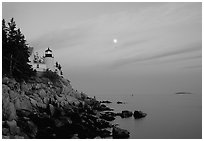 Bass Harbor lighthouse on rocky coast, sunset. Acadia National Park, Maine, USA. (black and white)