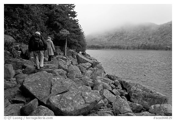 Hikers on shore of Jordan Pond. Acadia National Park, Maine, USA.