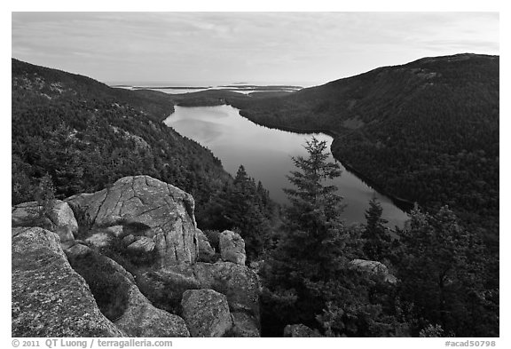 Forested hills and Jordan pond from above at dusk. Acadia National Park, Maine, USA.