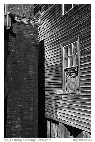 Miller standing at window, Mingus Mill, North Carolina. Great Smoky Mountains National Park (black and white)