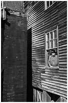 Miller standing at window, Mingus Mill, North Carolina. Great Smoky Mountains National Park, USA. (black and white)