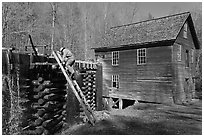Miller climbing onto millrace, Mingus Mill, North Carolina. Great Smoky Mountains National Park, USA. (black and white)