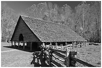 Cantilever barn and fence, Oconaluftee, North Carolina. Great Smoky Mountains National Park, USA. (black and white)