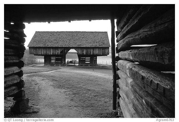 Cantilever barn framed by doorway, Cades Cove, Tennessee. Great Smoky Mountains National Park, USA.