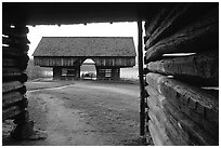 Cantilever barn framed by doorway, Cades Cove, Tennessee. Great Smoky Mountains National Park, USA. (black and white)
