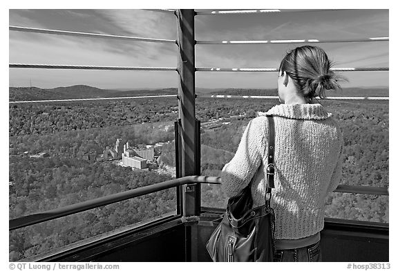 Tourist looking at the view from Hot Springs Mountain Tower in the fall. Hot Springs National Park (black and white)