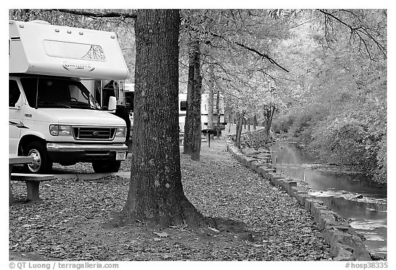 RV, trees in fall colors, and stream. Hot Springs National Park, Arkansas, USA.