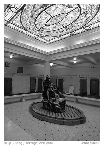 Court with stained glass roof in Fordyce bathhouse. Hot Springs National Park (black and white)