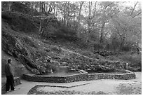 Visitor looking, hot spring cascade. Hot Springs National Park ( black and white)