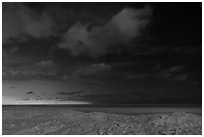 Distant Chicago skyline from West Beach at night. Indiana Dunes National Park ( black and white)