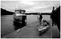 Canoists waiting for pick-up by the ferry at Chippewa harbor. Isle Royale National Park, Michigan, USA. (black and white)