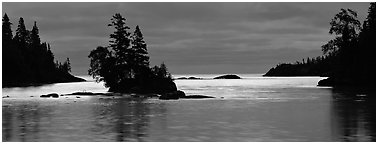 North woods lakescape with silhouetted trees. Isle Royale National Park (Panoramic black and white)