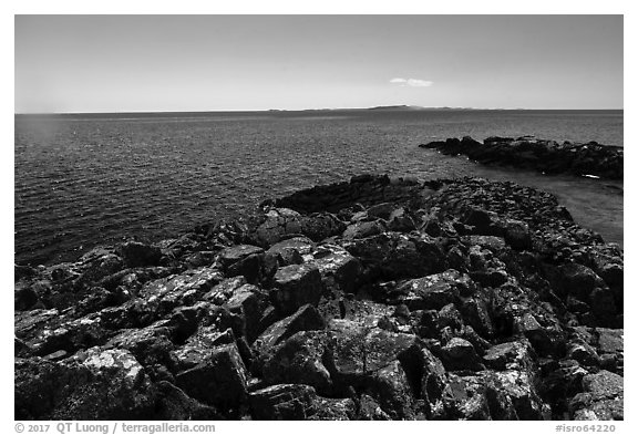 Lichen-covered rocks, Lake Superior, and Isle Royale from Passage Island. Isle Royale National Park (black and white)