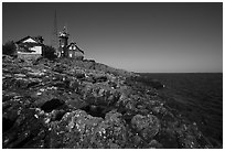 Lichen-covered rocks and Lighthouse, Passage Island. Isle Royale National Park ( black and white)