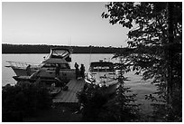 Dock with several boats moored, Tookers Island. Isle Royale National Park ( black and white)