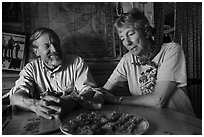Rolf Peterson and Carolyn Peterson with plate of rhubarb pie in their home. Isle Royale National Park ( black and white)