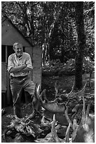 Rolf Peterson and moose skull and antlers collection. Isle Royale National Park ( black and white)