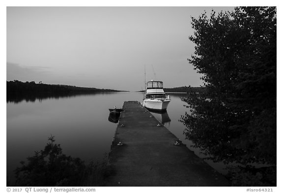 Moskey Basin dock with motorboat and ycaht, dusk. Isle Royale National Park (black and white)