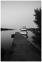 Motorboat and yacht moored at Moskey Basin dock. Isle Royale National Park ( black and white)