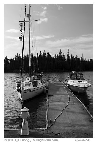 Sailboat and motorboat moored at Rock Harbor. Isle Royale National Park (black and white)