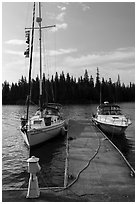 Sailboat and motorboat moored at Rock Harbor. Isle Royale National Park ( black and white)