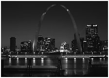 Arch and downtown skyline at night from East St Louis. Gateway Arch National Park ( black and white)