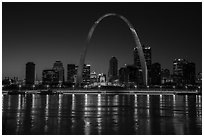 Arch, Old Courthouse and skyline reflected in Mississippi River at night. Gateway Arch National Park ( black and white)