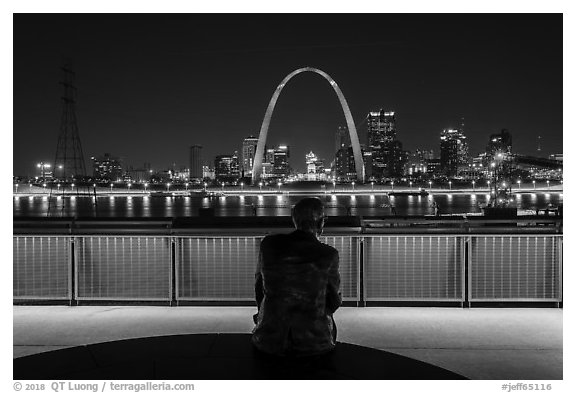 St Louis skyline and Malcom Martin statue from Mississippi River Overlook at night. Gateway Arch National Park (black and white)