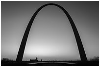 Arch at sunrise with curve of new visitor center roof. Gateway Arch National Park ( black and white)