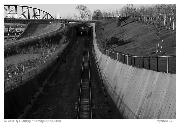 Curved south railroad walls and tunnel. Gateway Arch National Park (black and white)