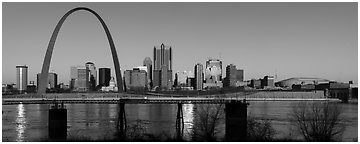 St Louis skyline across Mississippi River at sunrise. Gateway Arch National Park (Panoramic black and white)