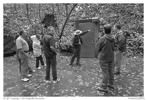 Ranger pointing to cave entrance to tourists. Mammoth Cave National Park (black and white)