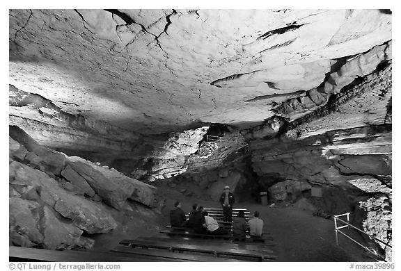 Tourists listening at ranger in large room inside cave. Mammoth Cave National Park (black and white)