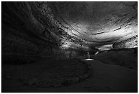 Visitors walk down huge corridor in cave. Mammoth Cave National Park ( black and white)