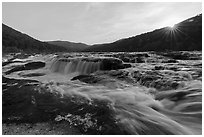 Sandstone Falls with sun star. New River Gorge National Park and Preserve ( black and white)