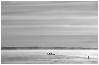 Boaters in fog, early morning, Kabetogama Lake. Voyageurs National Park ( black and white)